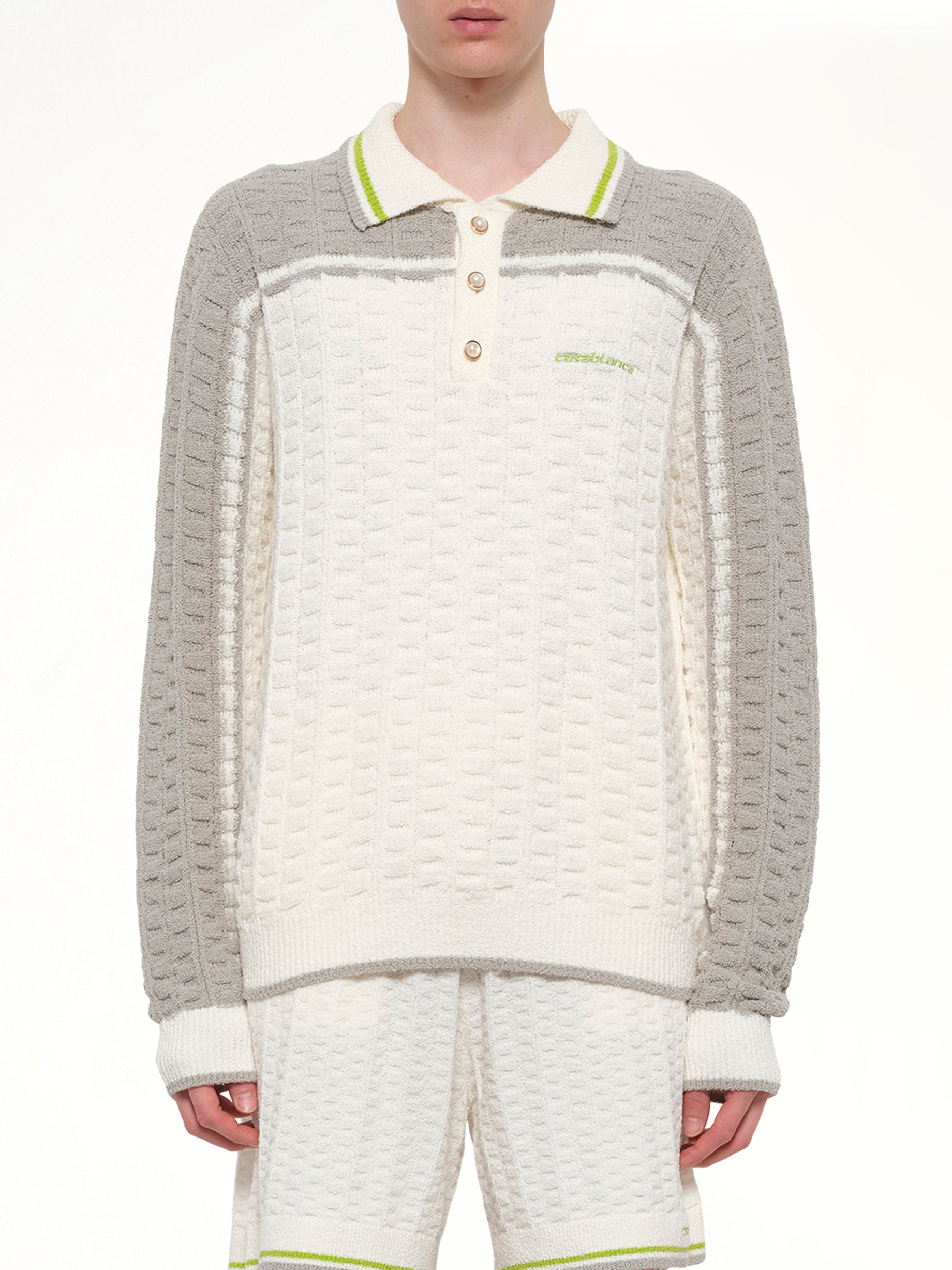 Image of a model wearing Tops. Product name - Tennis Boucle Long Sleeve Polo Shirt in White colour by brand - CASABLANCA