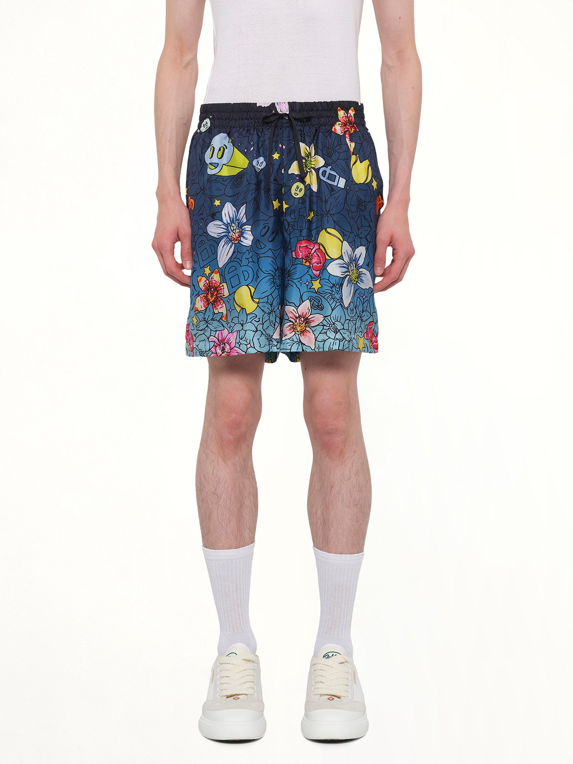 Image of a model wearing Shorts. Product name - Collage D’Icones Silk Shorts in Blue colour by brand - CASABLANCA