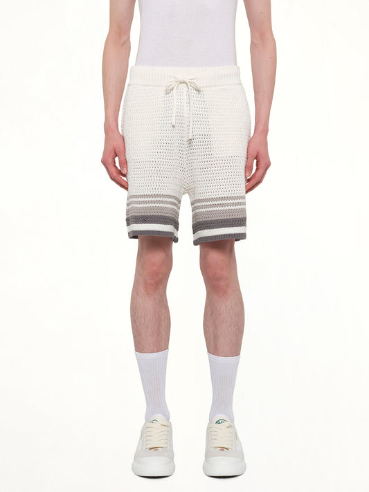 Image of a model wearing Shorts. Product name - Crochet Shorts in White colour by brand - CASABLANCA
