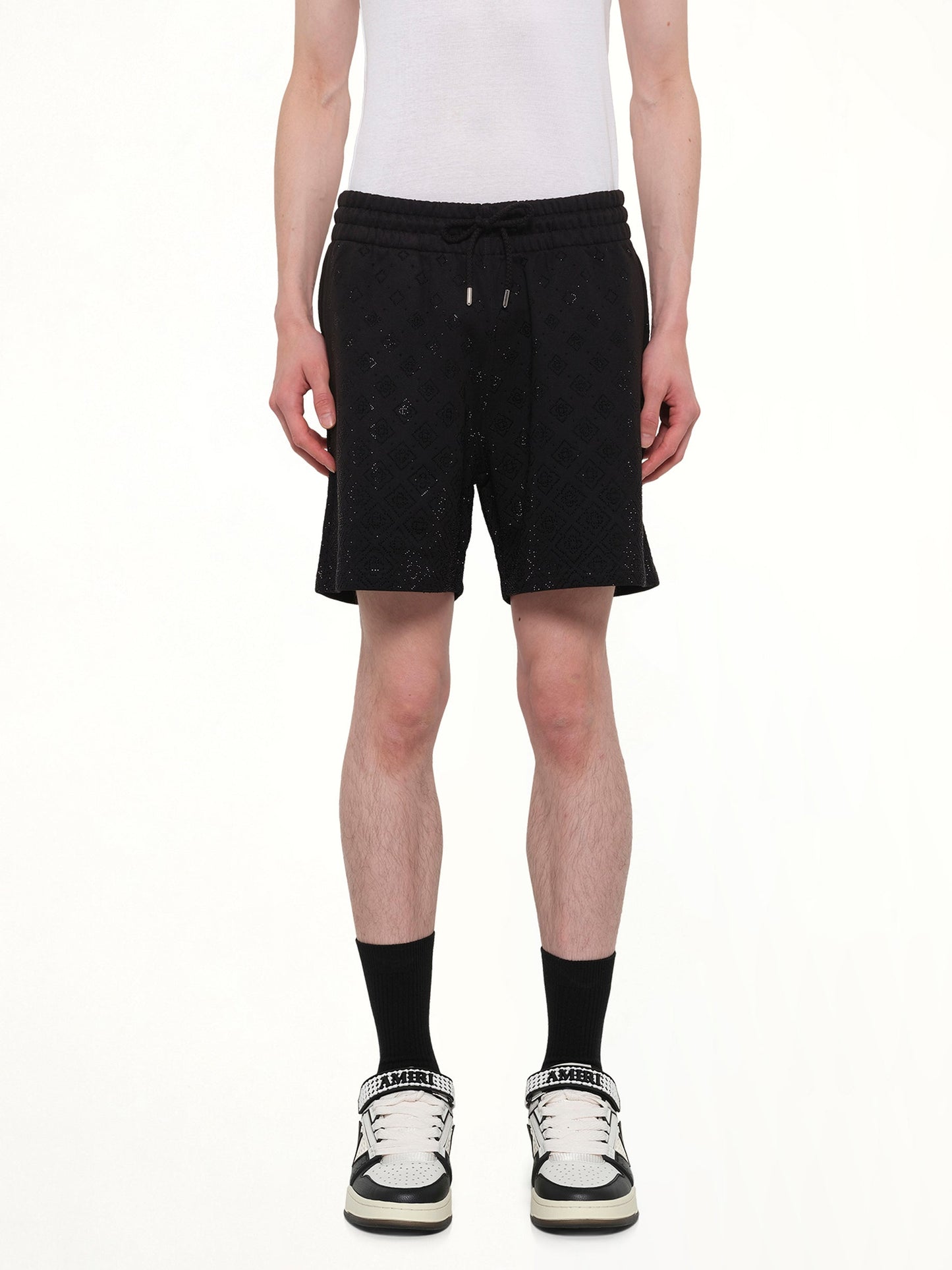 Image of a model wearing Shorts. Product name - Crystal Monogram Sweatshort in Black colour by brand - CASABLANCA