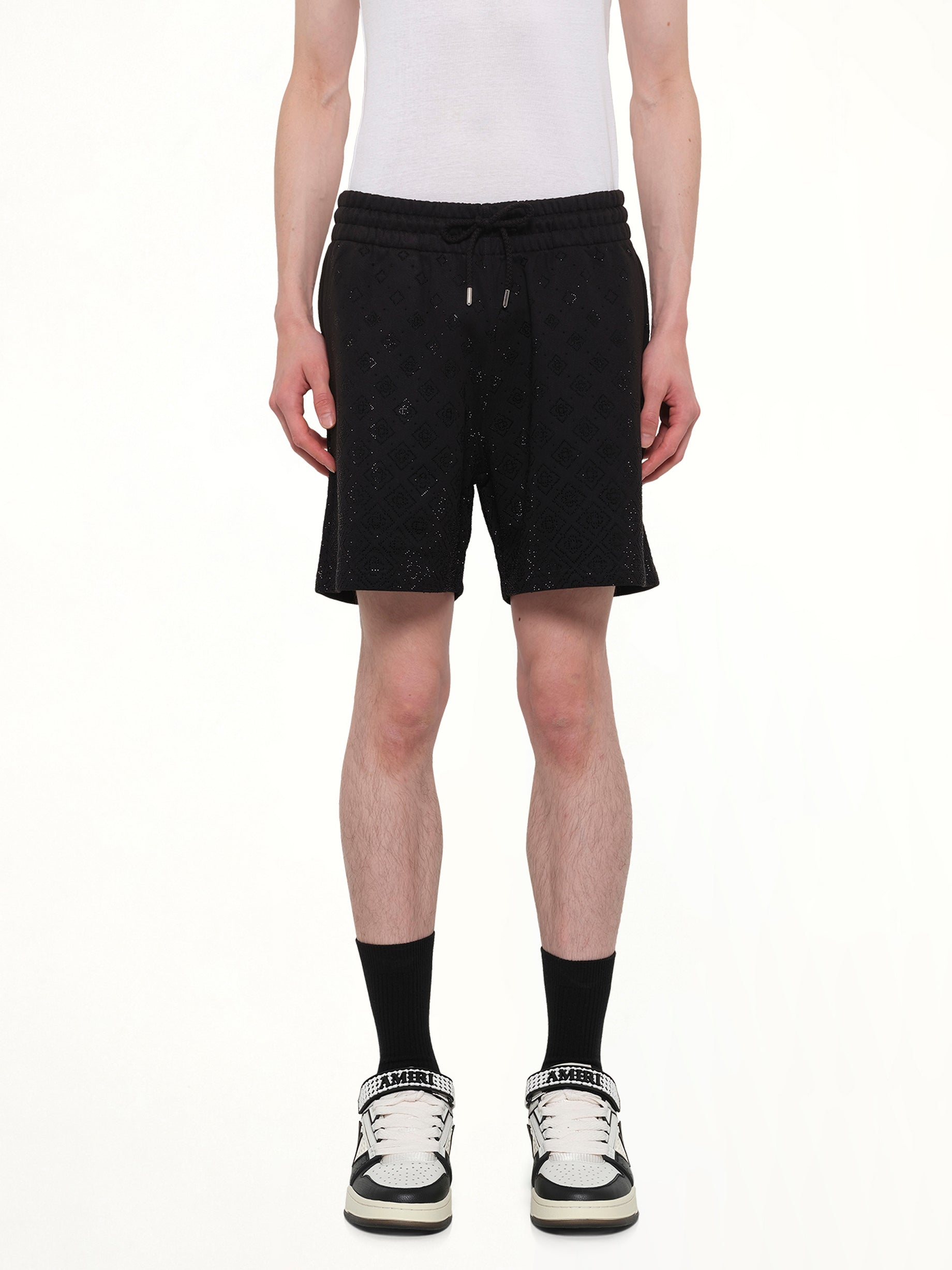 Image of a model wearing Shorts. Product name - Crystal Monogram Sweatshort in Black colour by brand - CASABLANCA