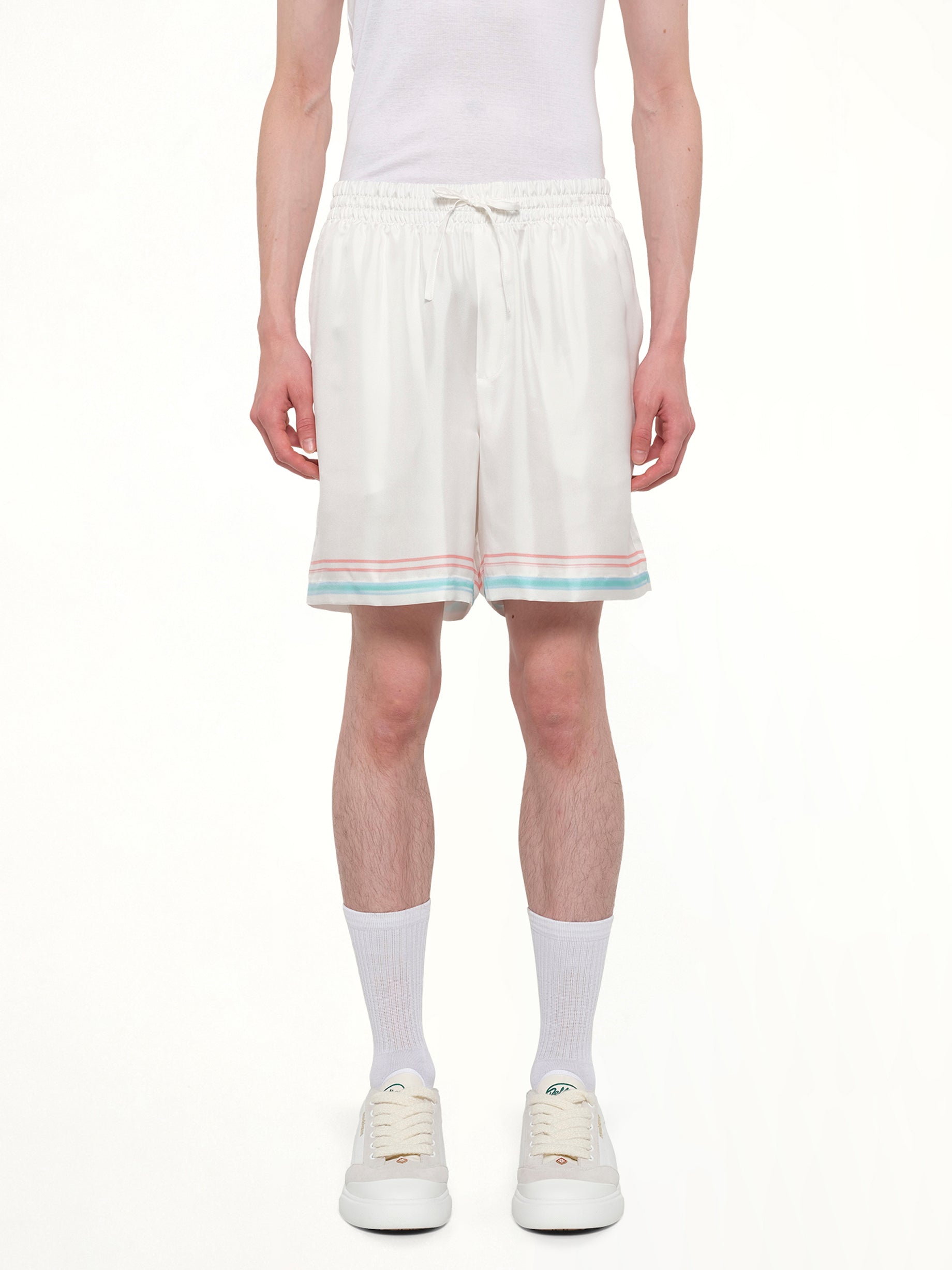 Image of a model wearing Shorts. Product name - Dance Joy Silk Shorts in White colour by brand - CASABLANCA