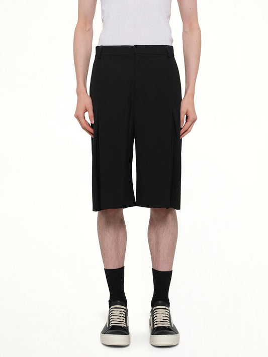 Image of a model wearing Shorts. Product name - Pleated Baggy Shorts in Black colour by brand - CASABLANCA