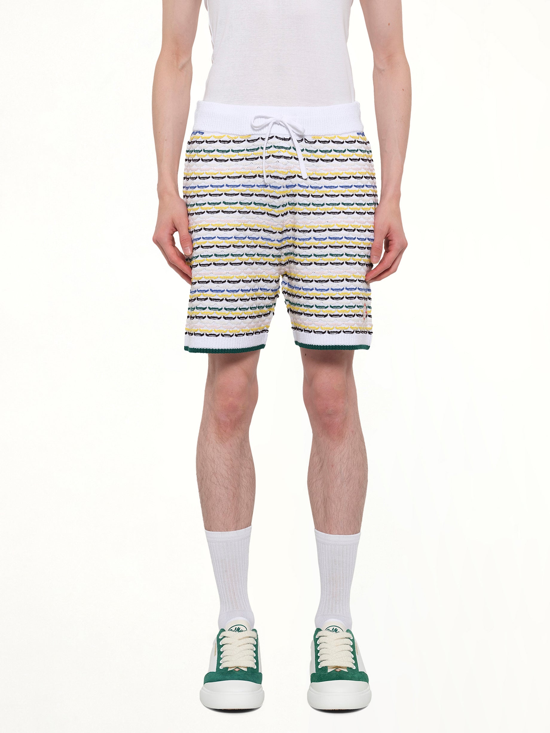 Image of a model wearing Shorts. Product name - Tuck Stitch Shorts in White colour by brand - CASABLANCA