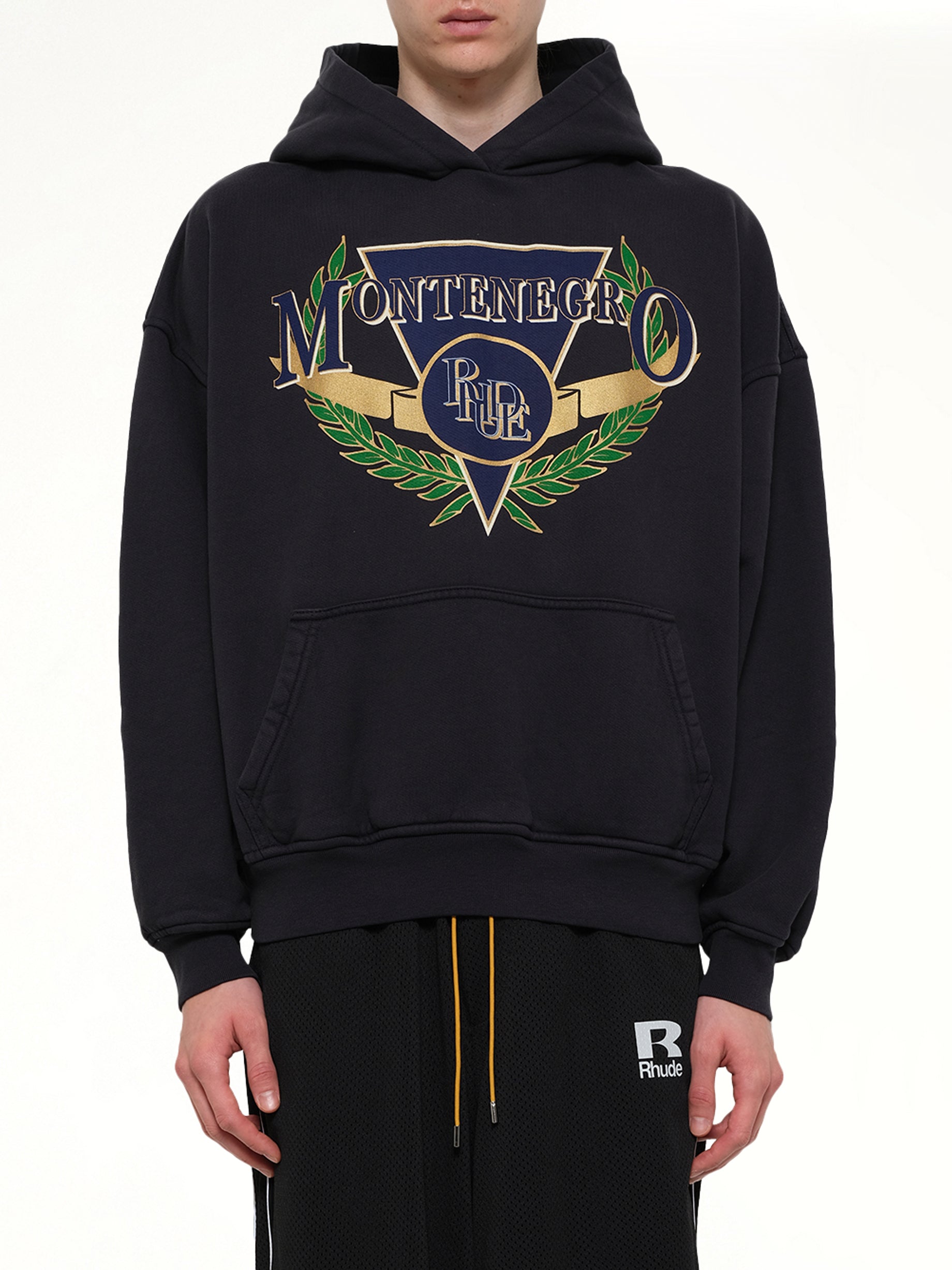 Image of a model wearing Outerwear. Product name - Montenegro Regatta Hoodie in Black colour by brand - RHUDE