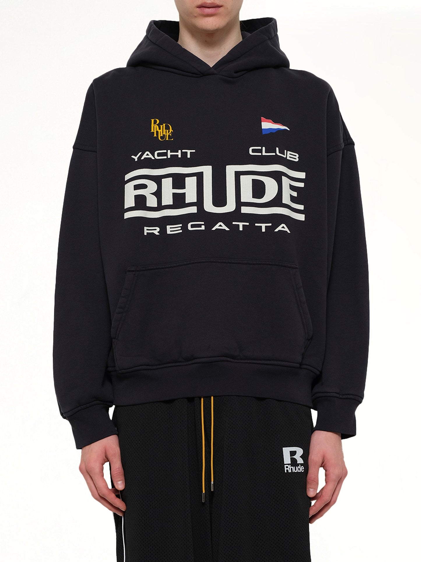 Image of a model wearing Outerwear. Product name - Rhude Regatta Club Hoodie in Black colour by brand - RHUDE