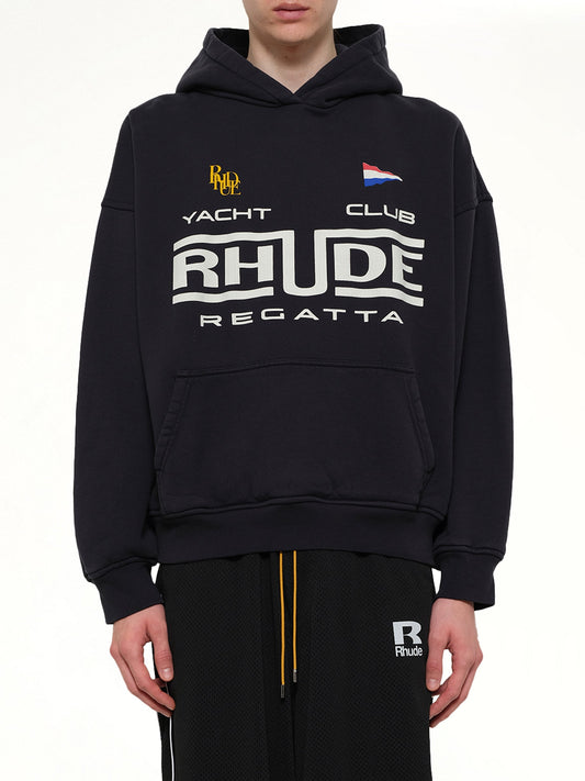 Image of a model wearing Outerwear. Product name - Rhude Regatta Club Hoodie in Black colour by brand - RHUDE