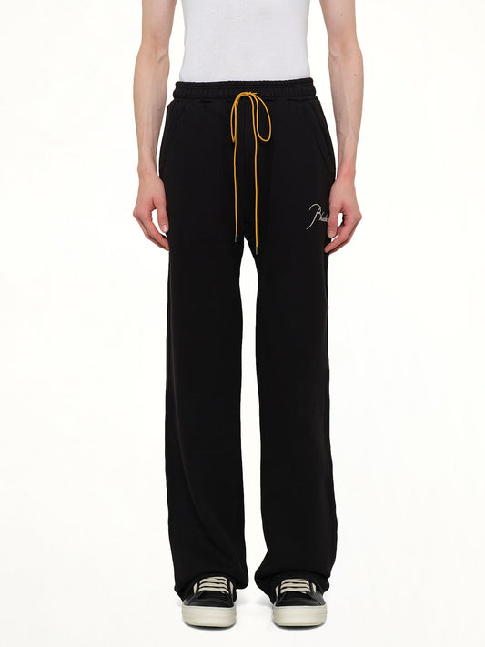 Image of a model wearing Pants. Product name - Classique Sweatpant in Black colour by brand - RHUDE