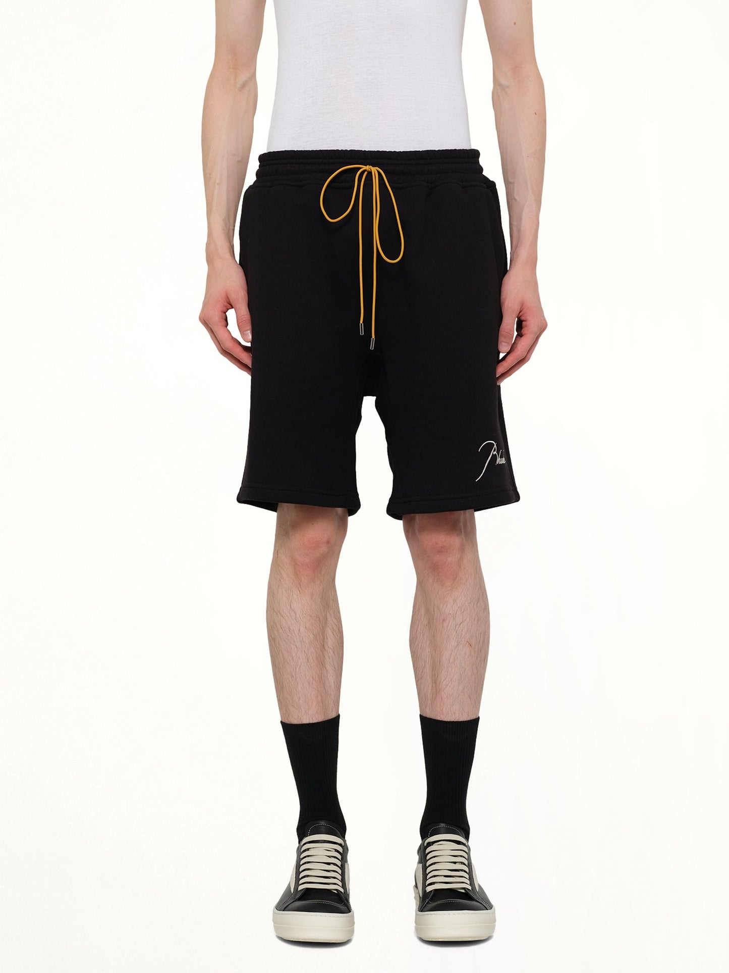 Image of a model wearing Shorts. Product name - Classique Sweatshorts in Black colour by brand - RHUDE