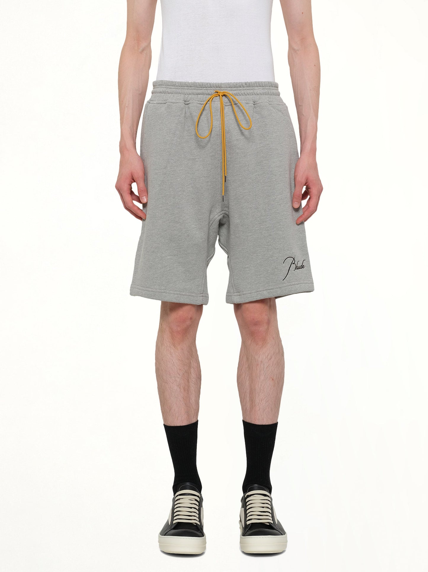 Image of a model wearing Shorts. Product name - Classique Sweatshort in Grey colour by brand - RHUDE