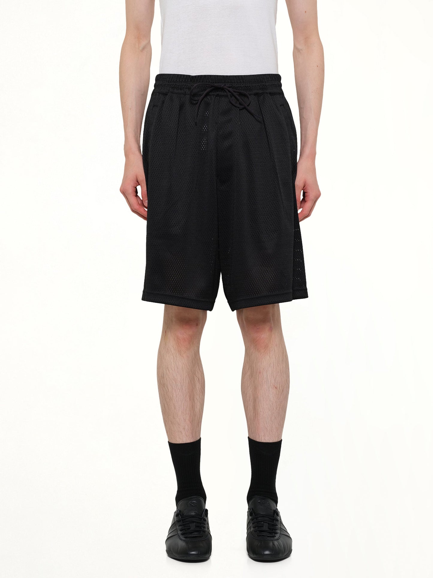 Image of a model wearing Shorts. Product name - Mesh Shorts in Black colour by brand - Y-3