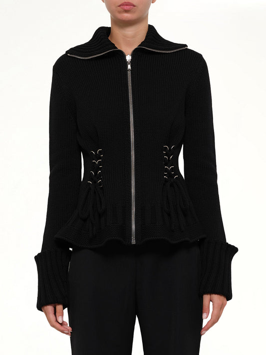 Image of a model wearing Outerwear. Productname: Amq Lace Up Cardigan in Black colour by brand - ALEXANDER MCQUEEN