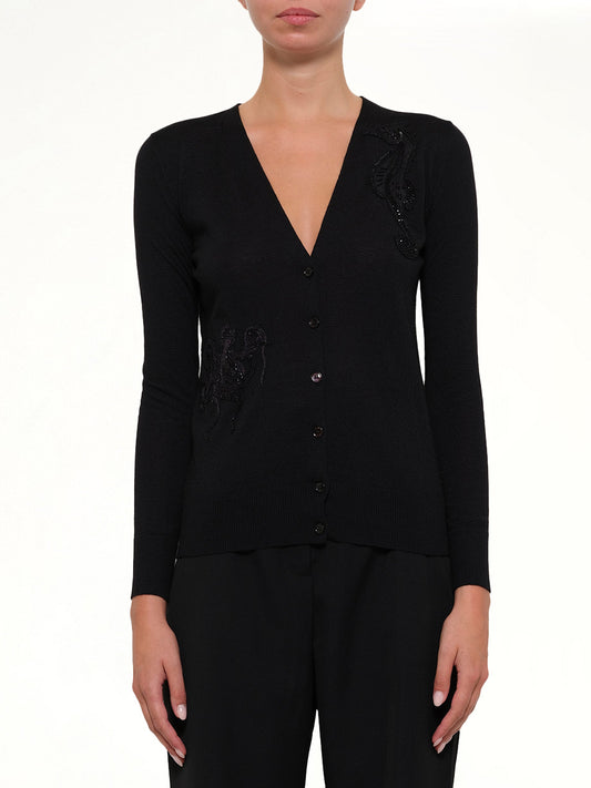 Image of a model wearing Outerwear. Productname: V Neck Cardigan in Black colour by brand - ALEXANDER MCQUEEN