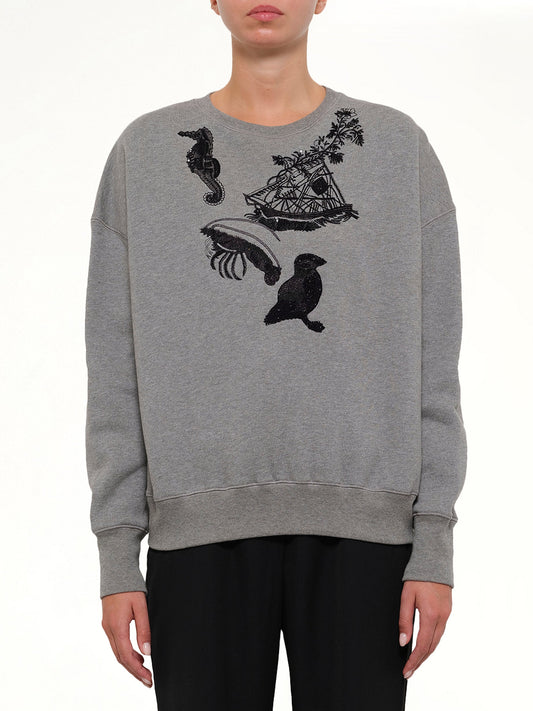 Image of a model wearing Outerwear. Productname: Amq Sea Creat Emb Sweater in Black colour by brand - ALEXANDER MCQUEEN