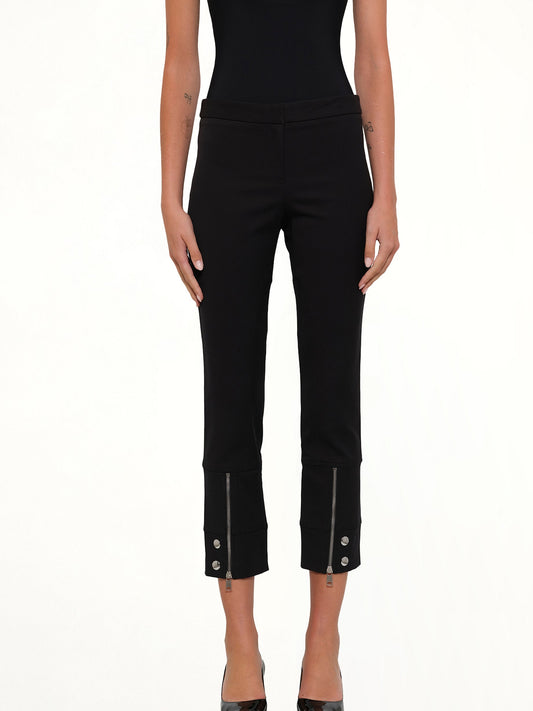 Image of a model wearing Pants. Productname: AMQ Fitted Zip Pants in Black colour by brand - ALEXANDER MCQUEEN