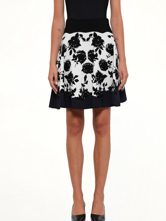 Image of a model wearing Skirts. Productname: Amq Rose Jacq Mini Skirt in Ivo/Blk colour by brand - ALEXANDER MCQUEEN