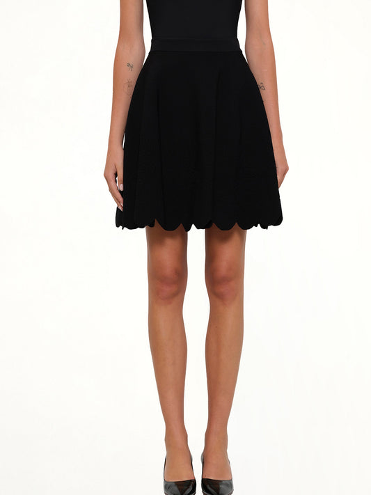 Image of a model wearing Skirts. Productname: Emb Rose Mini Skirt in Black colour by brand - ALEXANDER MCQUEEN