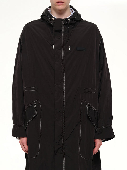Image of a model wearing Outerwear. Product name - Long Parka in Black colour by brand - AMI PARIS