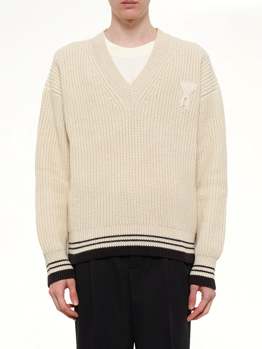 Image of a model wearing Outerwear. Product name - Ami De Coeur V Neck College Sweater in White colour by brand - AMI PARIS