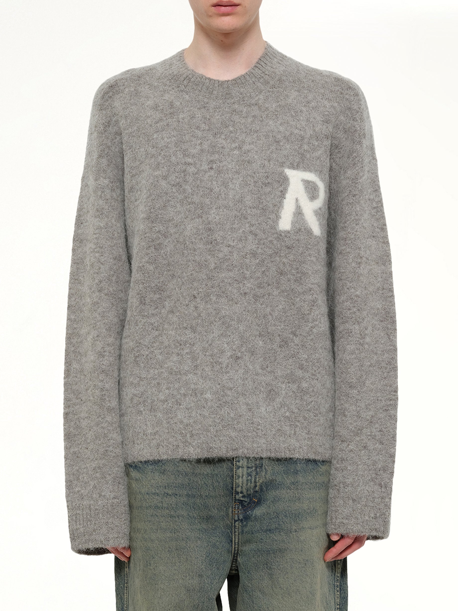 Image of a model wearing Outerwear. Product name - Logo Knit Sweater in Grey colour by brand - REPRESENT