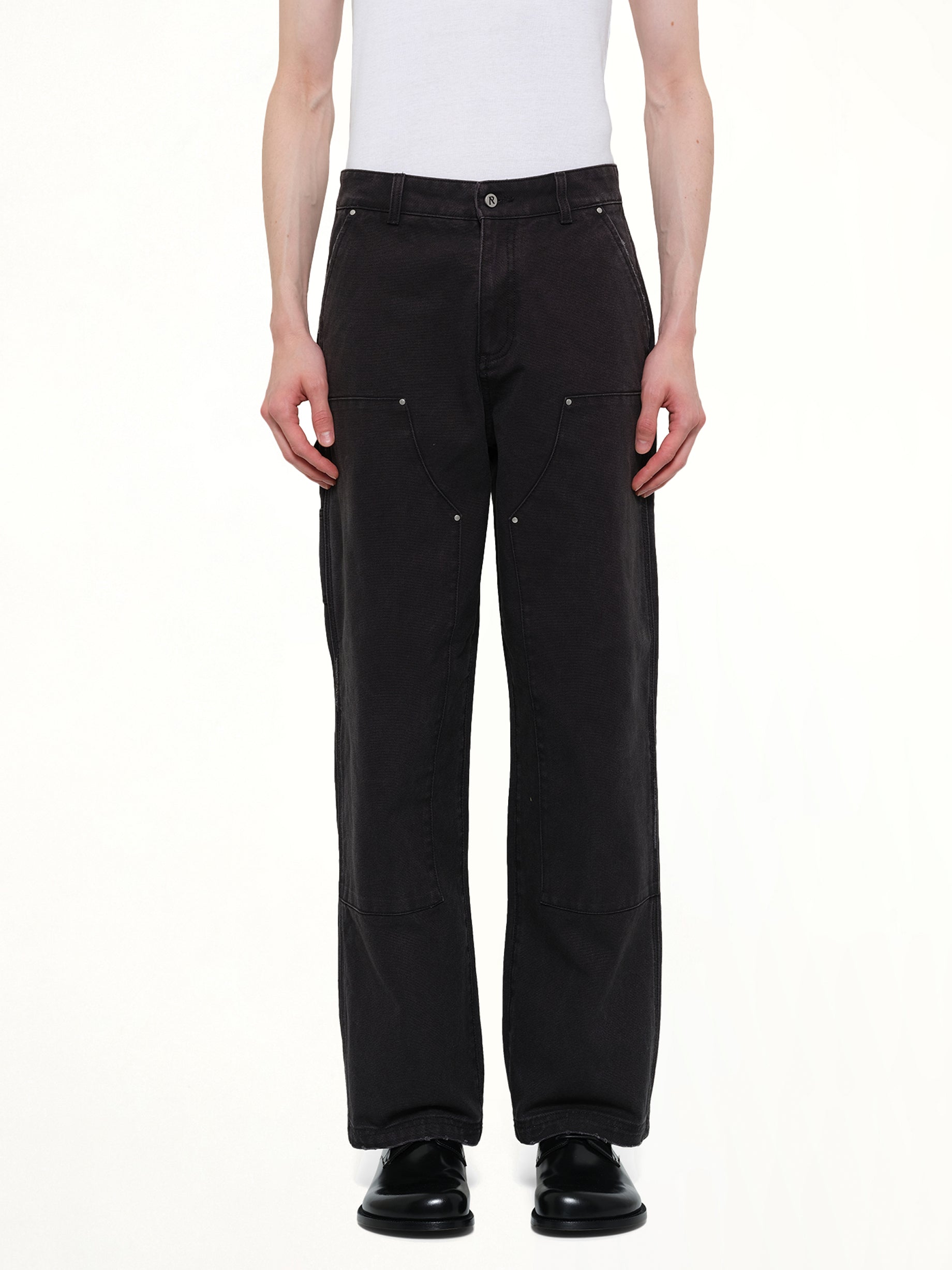 Image of a model wearing Pants. Product name - Worker Pant in Black colour by brand - REPRESENT