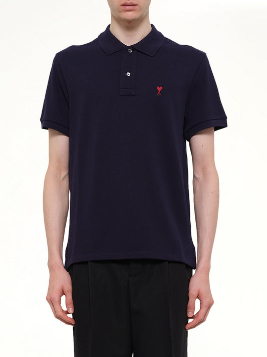 Image of a model wearing Tops. Product name - Red Ami De Coeur Polo in Navy colour by brand - AMI PARIS