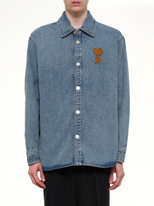 Image of a model wearing Tops. Product name - Knitted ADC Denim Shirt in Blue colour by brand - AMI PARIS