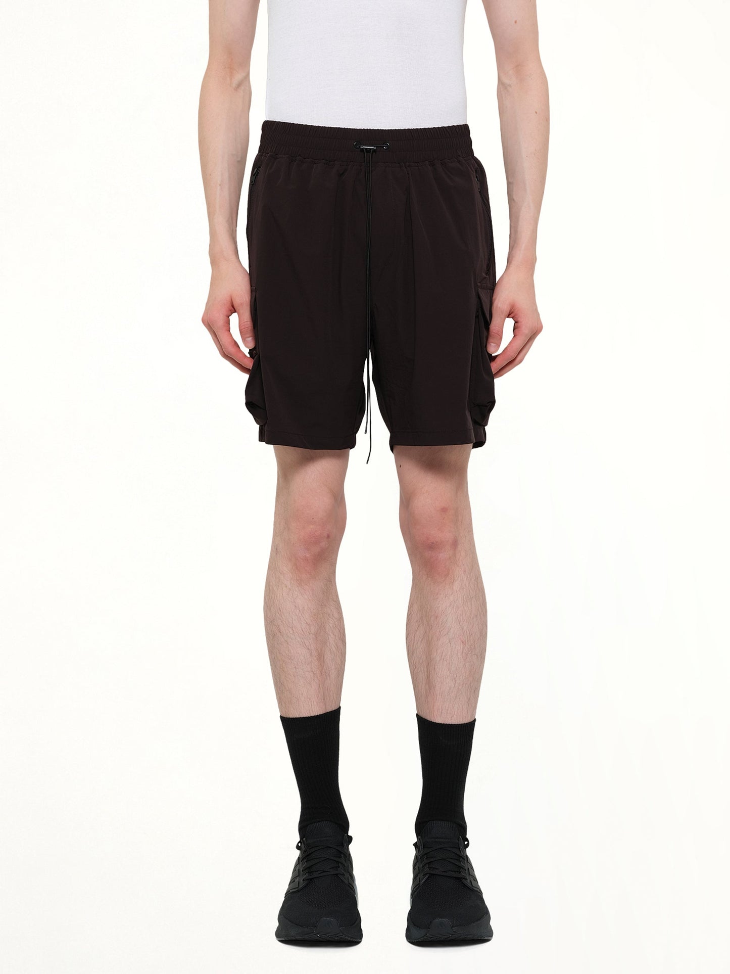 Image of a model wearing Shorts. Product name - 247 Shorts in Black colour by brand - REPRESENT