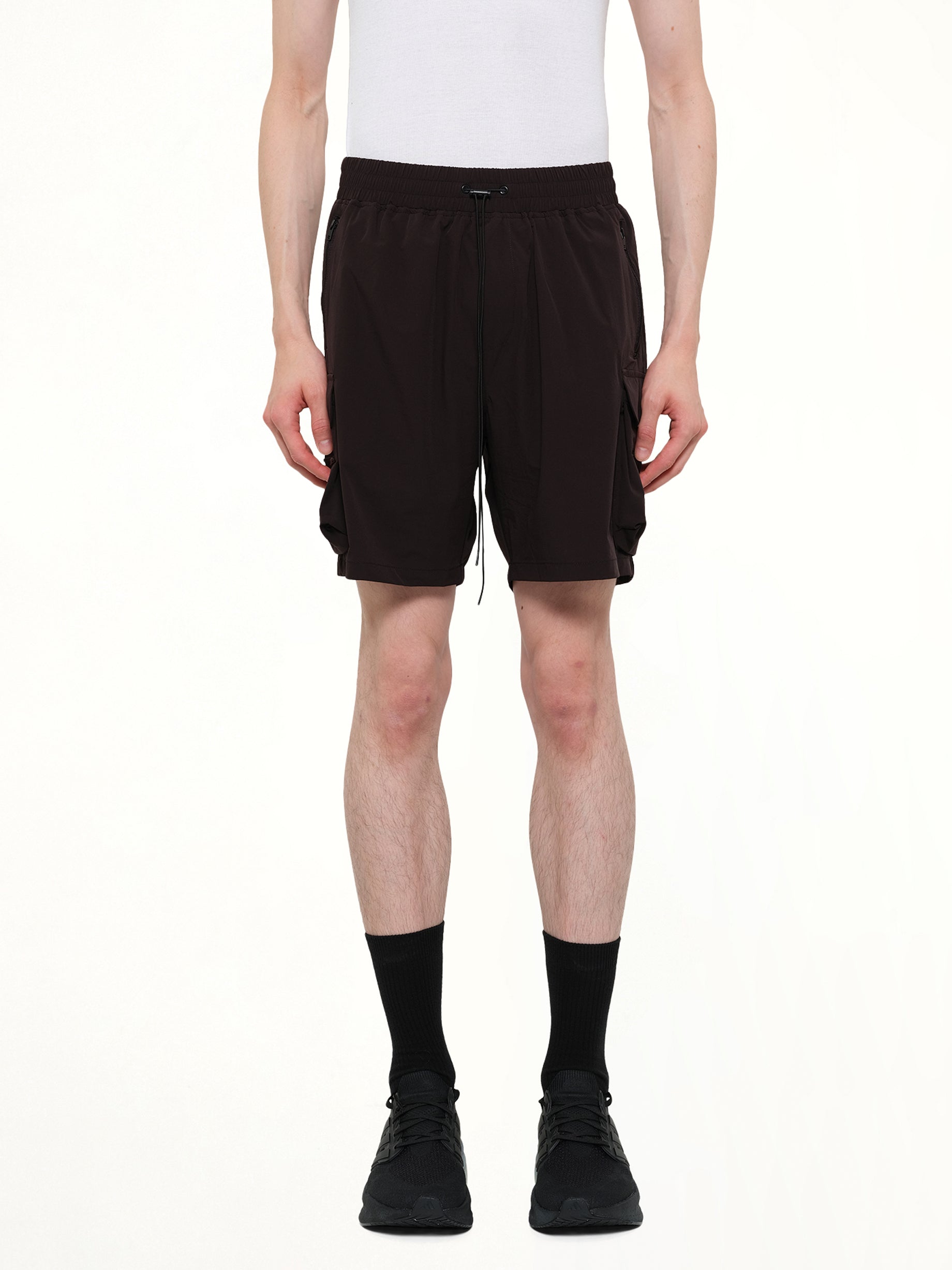Image of a model wearing Shorts. Product name - 247 Shorts in Black colour by brand - REPRESENT