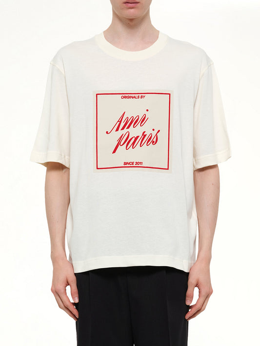 Image of T-Shirts. Product name - Signature Print Boxy Fit T-Shirt in White colour by brand - AMI PARIS