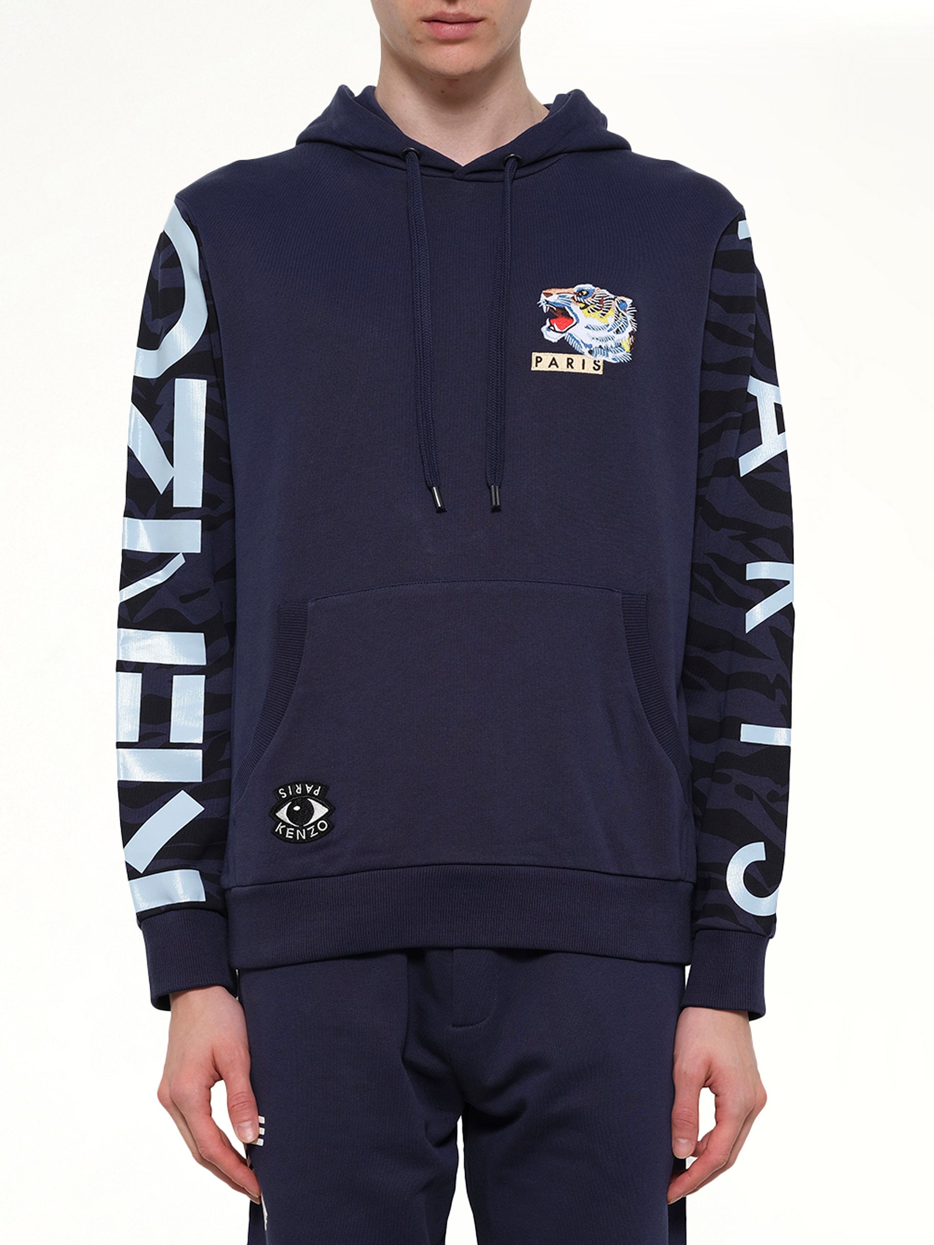 Image of a model wearing Outerwear. Product name - Icons Hoodie in Ink colour by brand - KENZO