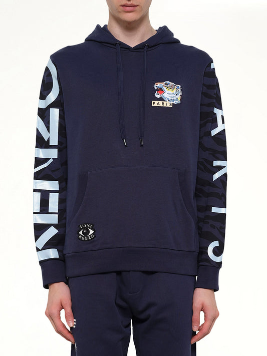 Image of a model wearing Outerwear. Product name - Icons Hoodie in Ink colour by brand - KENZO