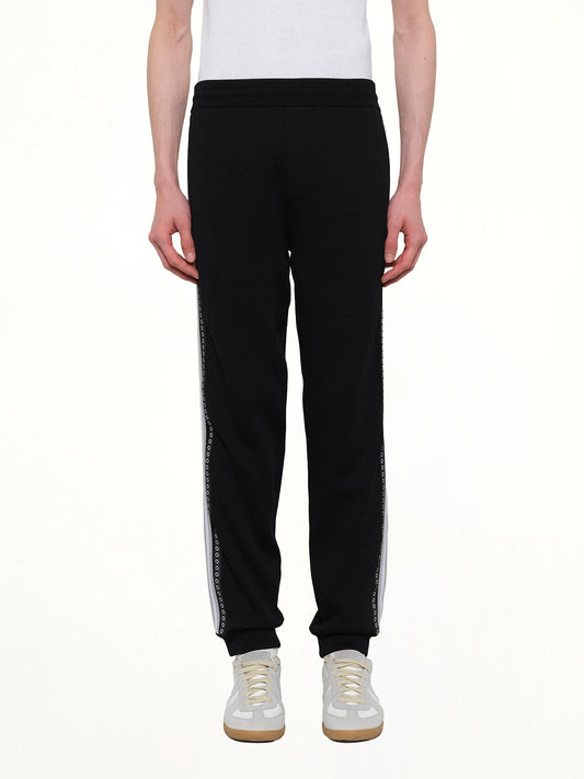 Image of a model wearing Pants. Product name - Classic Kenzo Pants in Black colour by brand - KENZO