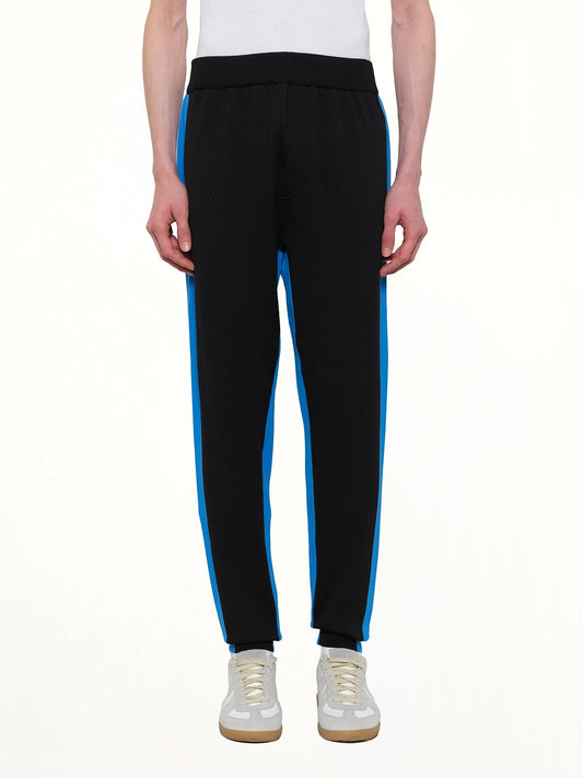 Image of a model wearing Pants. Product name - Technical Pants in Black colour by brand - KENZO
