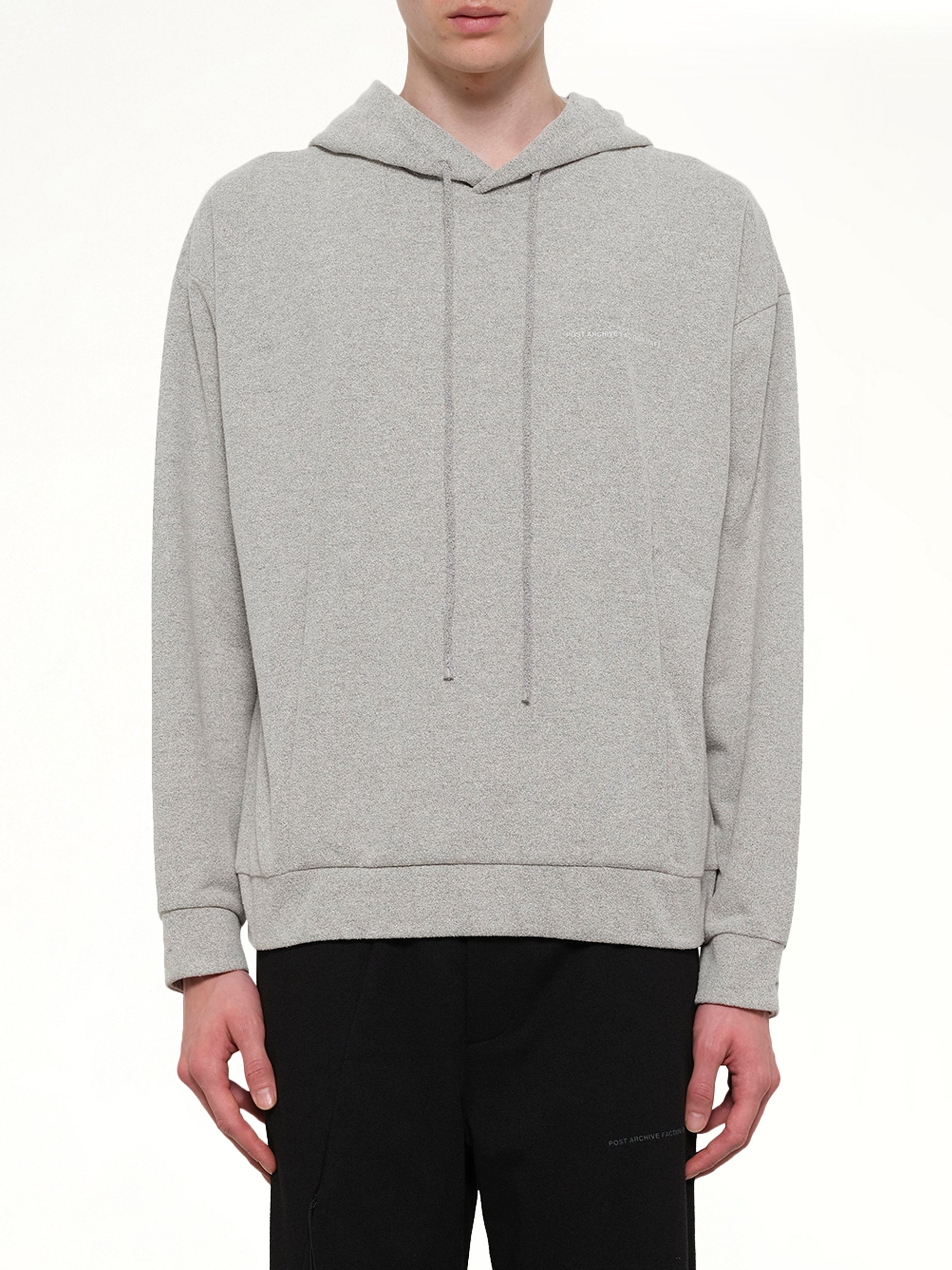 Image of a model wearing Outerwear. Product name - Work Hoodie (Archive) in Grey colour by brand - POST ARCHIVE FACTION