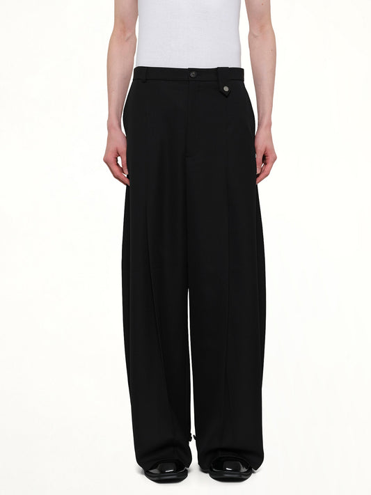 Image of a model wearing Pants. Product name - Fluid Tailored Wide Leg Pants in Black colour by brand - EGONLAB