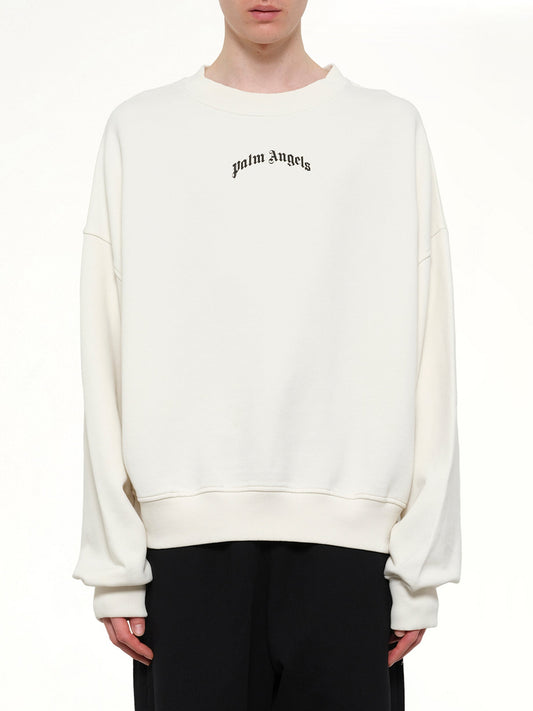 Image of a model wearing Outerwear. Product name - Back Curved Logo Loose Sweatshirt in White colour by brand - PALM ANGELS