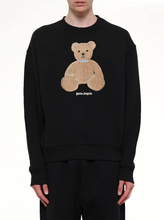Image of a model wearing Outerwear. Product name - Bear Regular Sweatshirt in Black colour by brand - PALM ANGELS