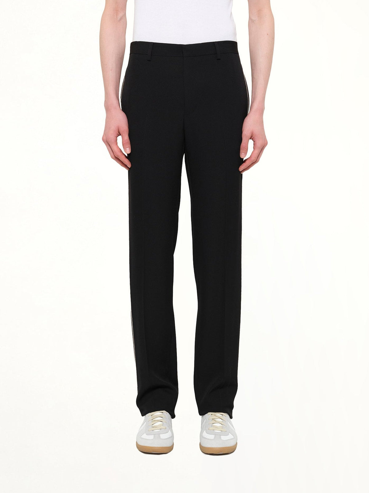 Image of a model wearing Pants. Product name - Givenchy Trousers in Black colour by brand - GIVENCHY