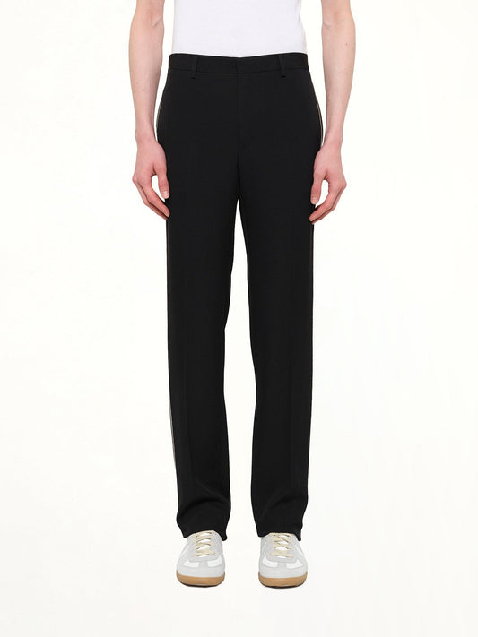 Image of a model wearing Pants. Product name - Givenchy Trousers in Black colour by brand - GIVENCHY