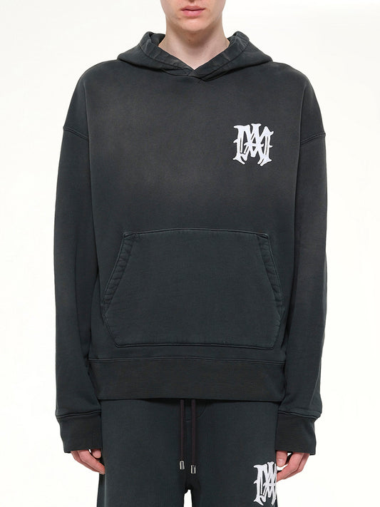 Image of a model wearing Outerwear. Product name - Amiri Hollywood Oversized Hoodie in Black colour by brand - AMIRI