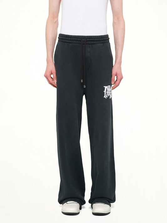Image of a model wearing Pants. Product name - Amiri Hollywood Sweatpants in Black colour by brand - AMIRI