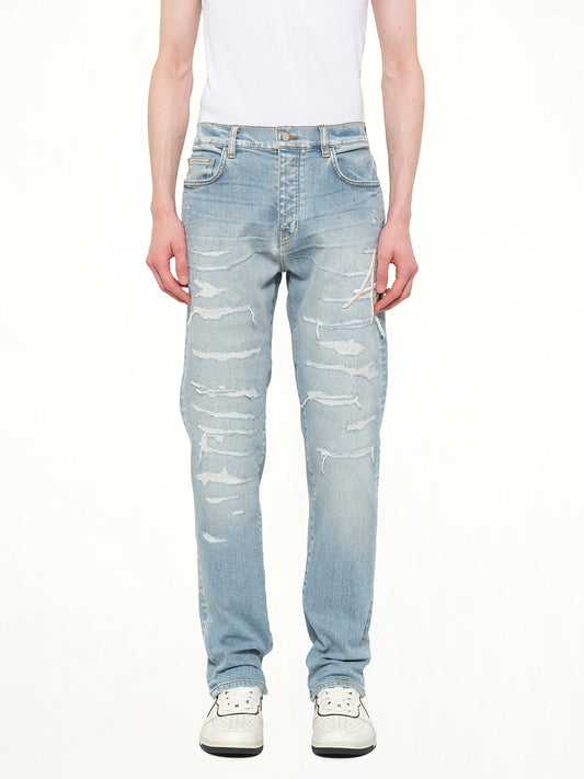 Image of Jeans. Product name - Amiri Repaired Slim Jean in Blue colour by brand - AMIRI