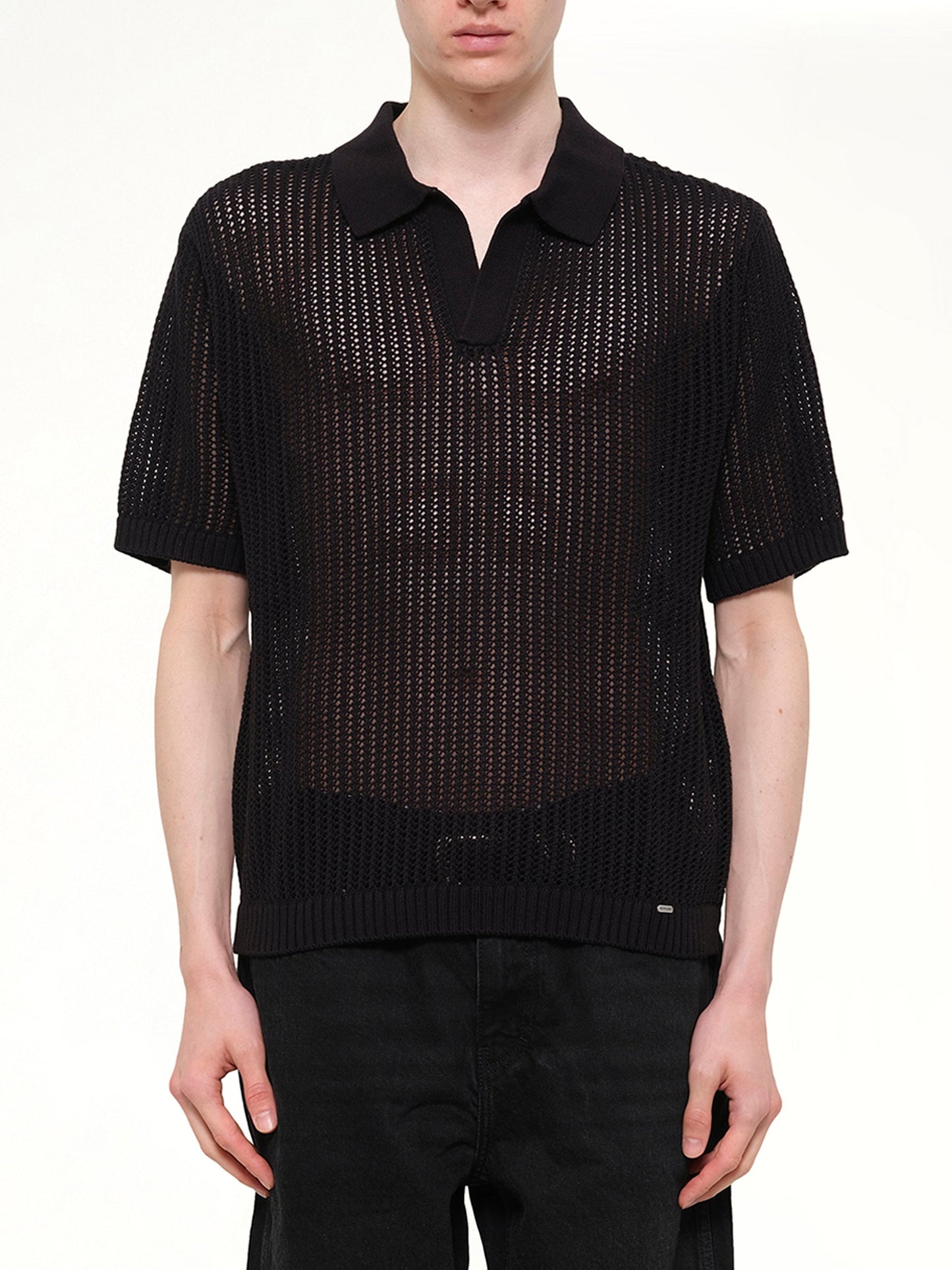 Image of a model wearing Tops. Product name - Beverly Knit Polo in Black colour by brand - REPRESENT