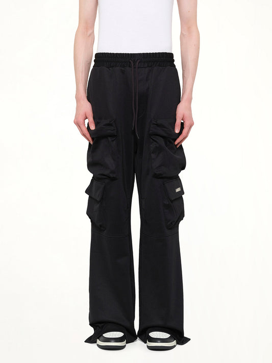 Image of a model wearing Pants. Product name - Cargo Track Pants in Black colour by brand - AMIRI