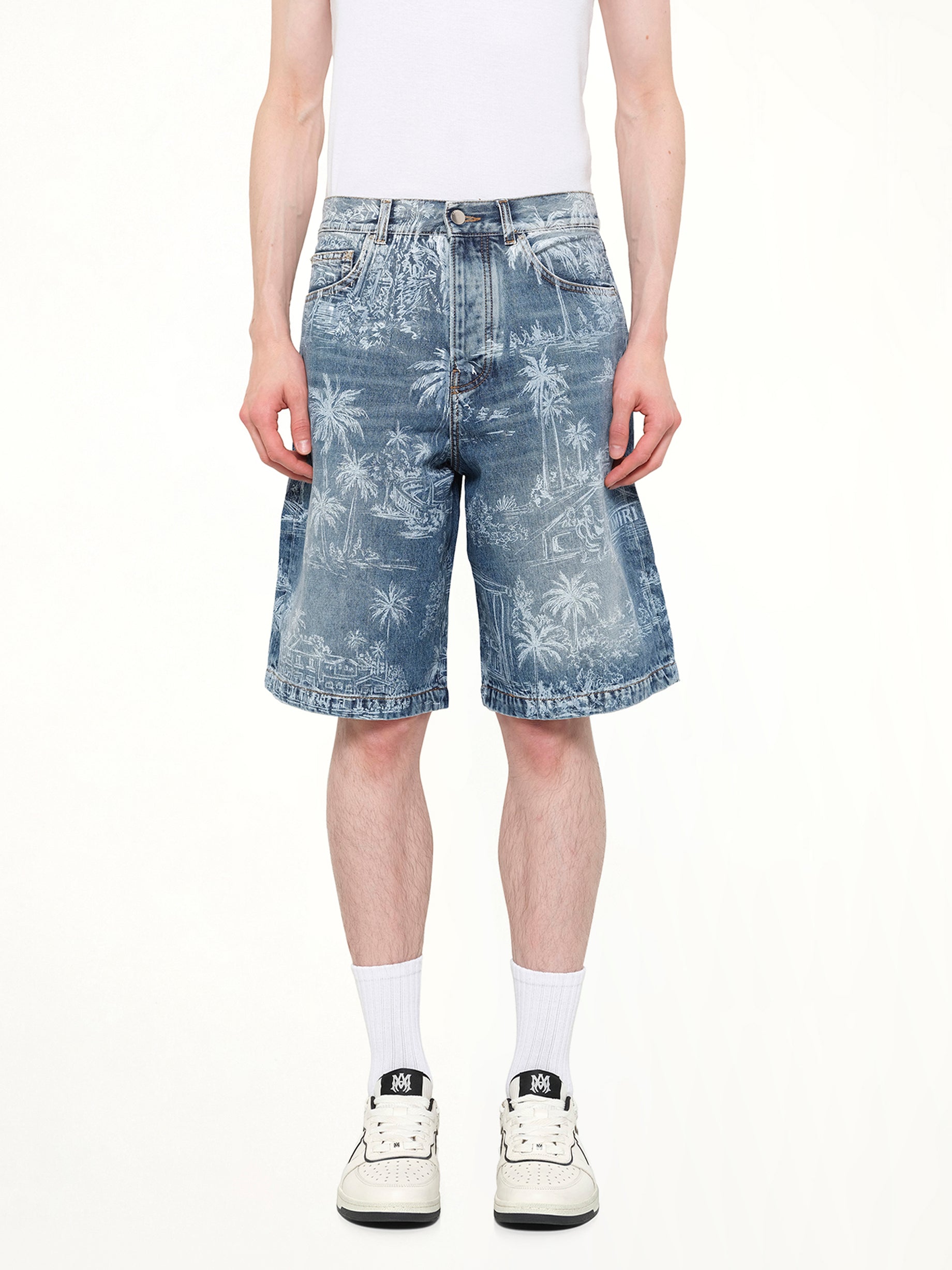 Image of a model wearing Shorts. Product name - Chateau Palms Denim Shorts in Indigo colour by brand - AMIRI
