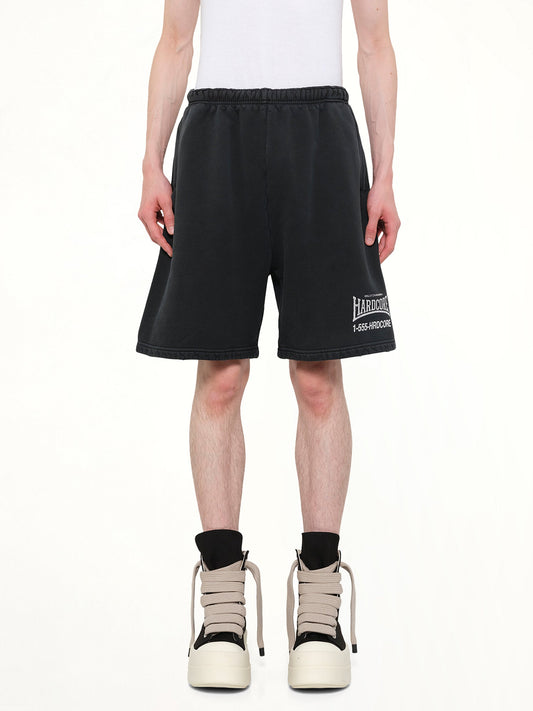 Image of a model wearing Shorts. Product name - "Hardcore" Buffalo Sweatshort in Black colour by brand - WILLY CHAVARRIA