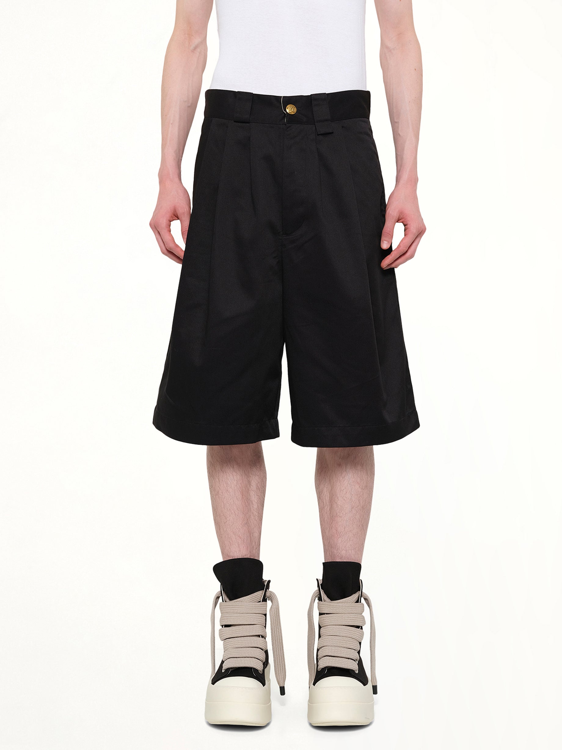 Image of a model wearing Shorts. Product name - Borracho Short in Black colour by brand - WILLY CHAVARRIA