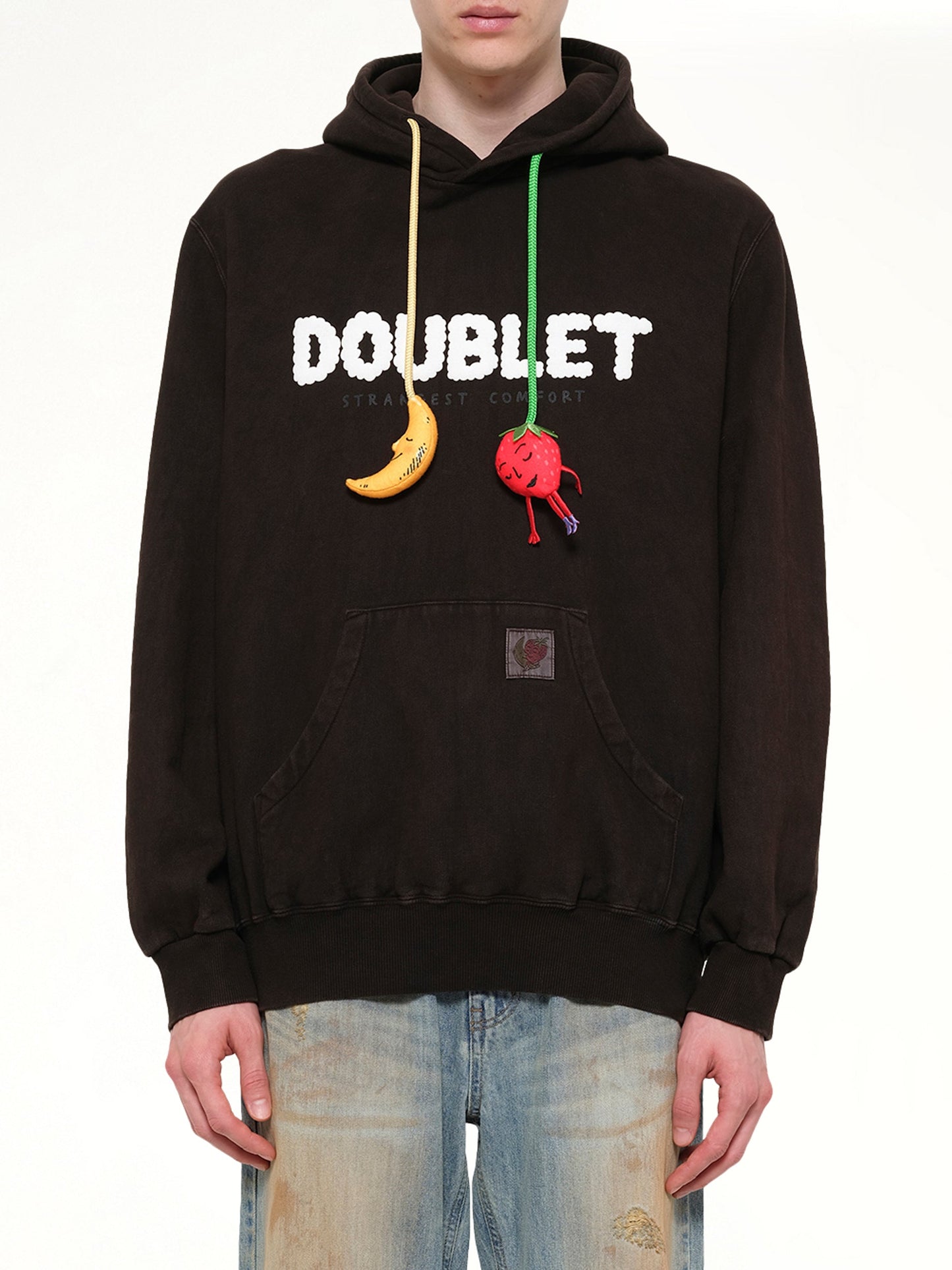 Image of a model wearing Outerwear. Product name - Mud-Dyed Hoodie With SHFU in Brown colour by brand - DOUBLET