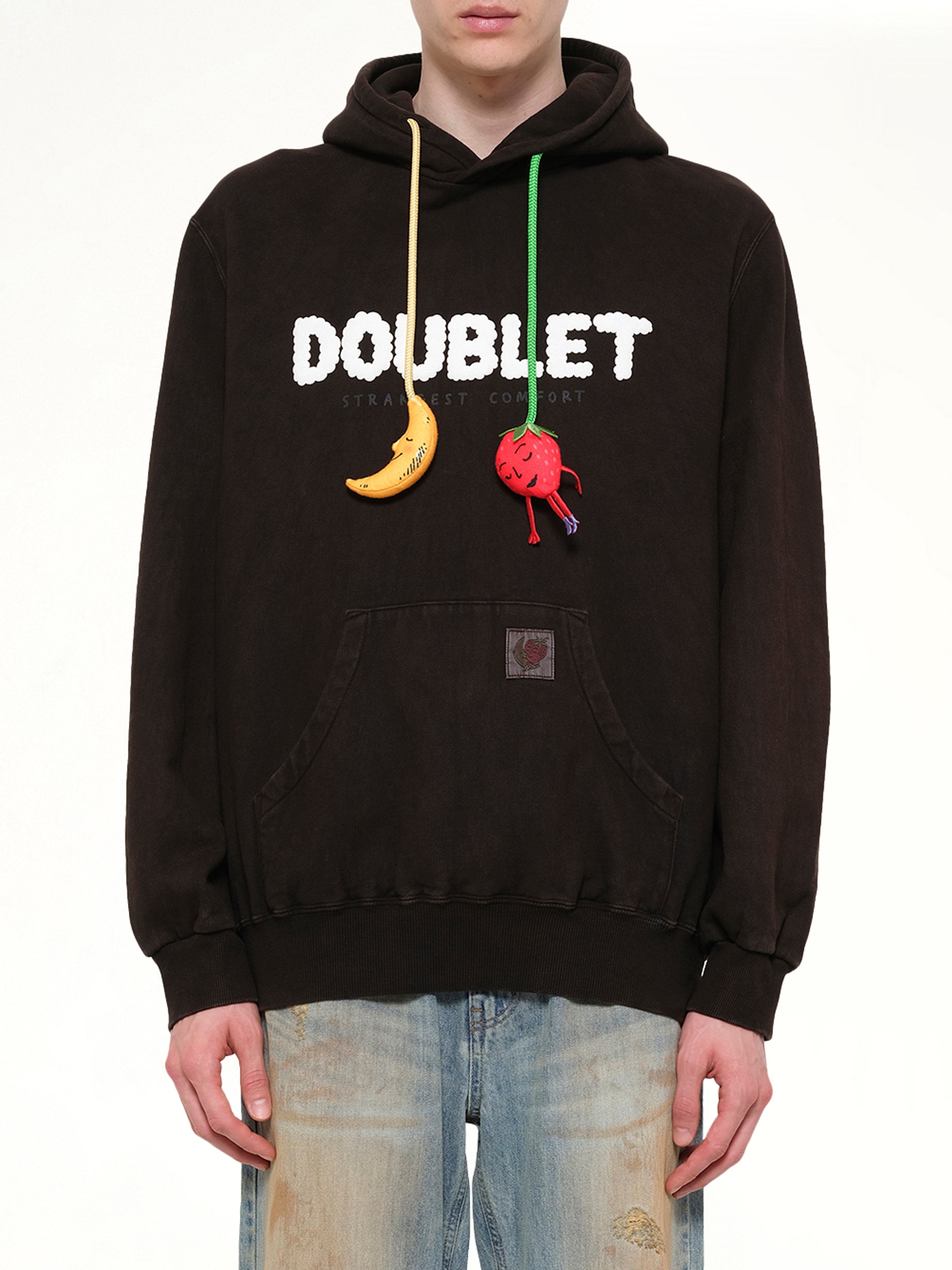 Image of a model wearing Outerwear. Product name - Mud-Dyed Hoodie With SHFU in Brown colour by brand - DOUBLET